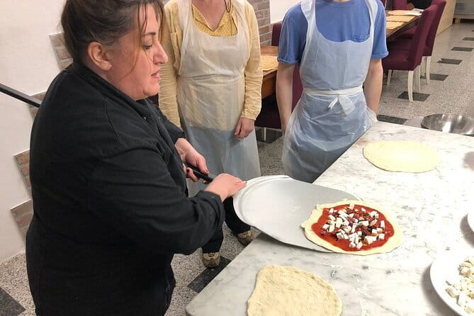 Pizza & Gelato Making Cooking Class in Florence - The dinner payoff: unlimited wine and what it changes